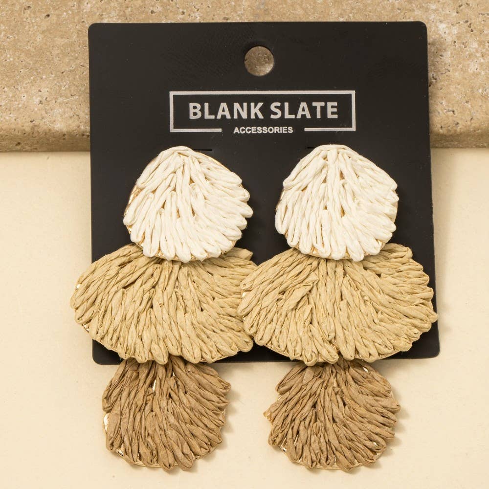 Beige and white tassel earrings on a 'Blank Slate Accessories' card.