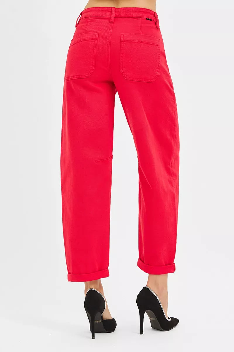 Red pants worn by a person on a white background
