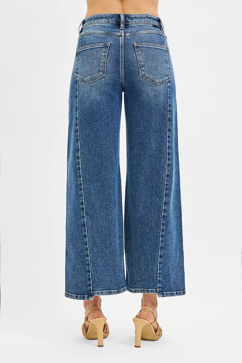 Blue wide-leg jeans on a white background