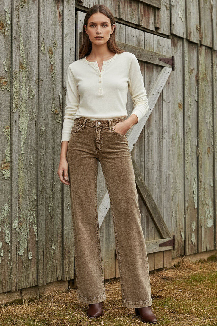 Brown wide-leg jeans on a white background