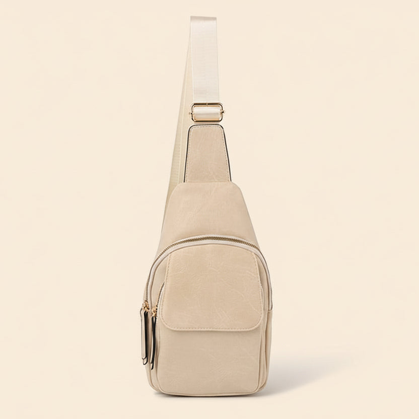 Beige sling bag on a beige background