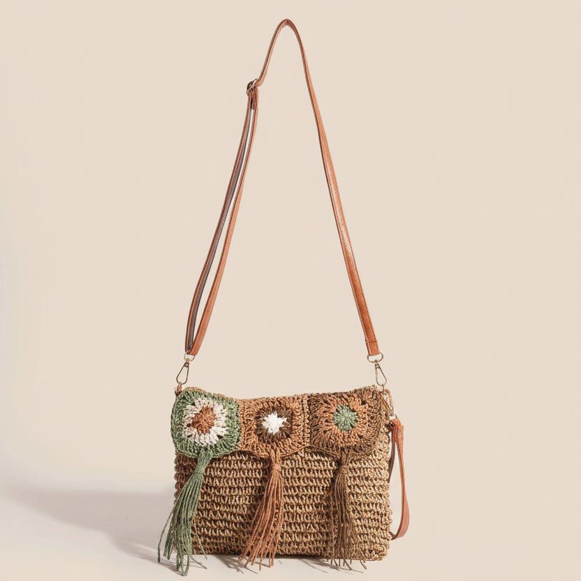 Crocheted handbag with owl design on a beige background