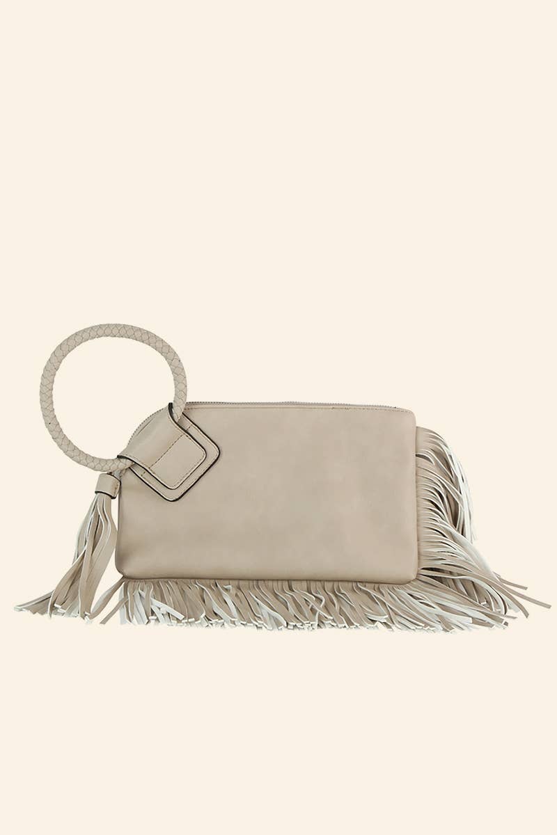 Beige handbag with fringe details on a white background