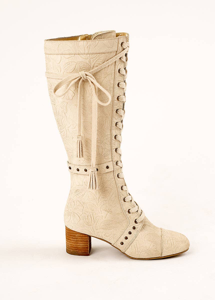 Beige knee-high boot with lace-up design on a white background