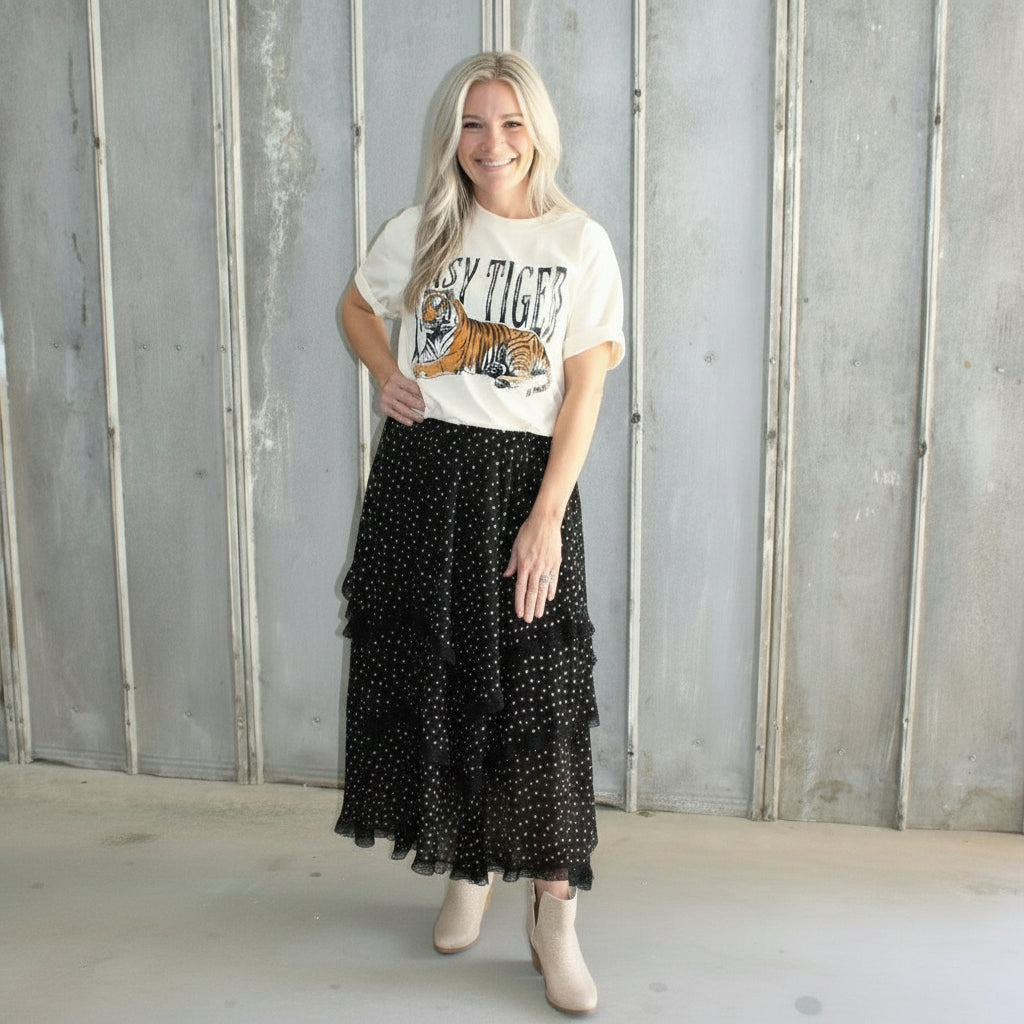 Person lying on a concrete floor with a wall in the background