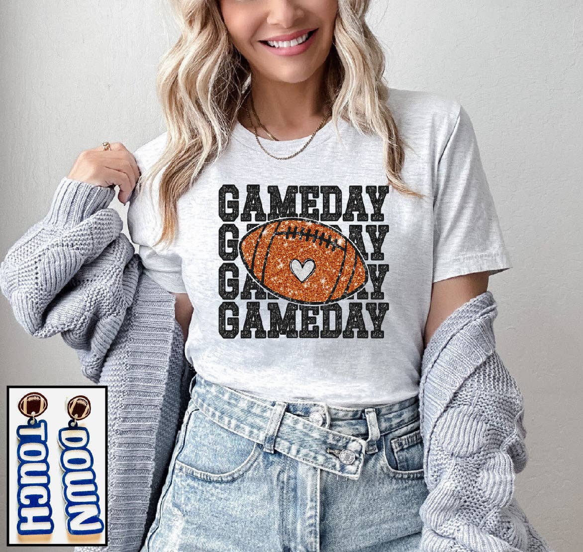 Person wearing a 'GAMEDAY' t-shirt with a football graphic on a plain background