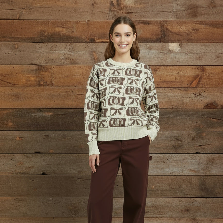 Brown pants and patterned shirt on a wooden floor