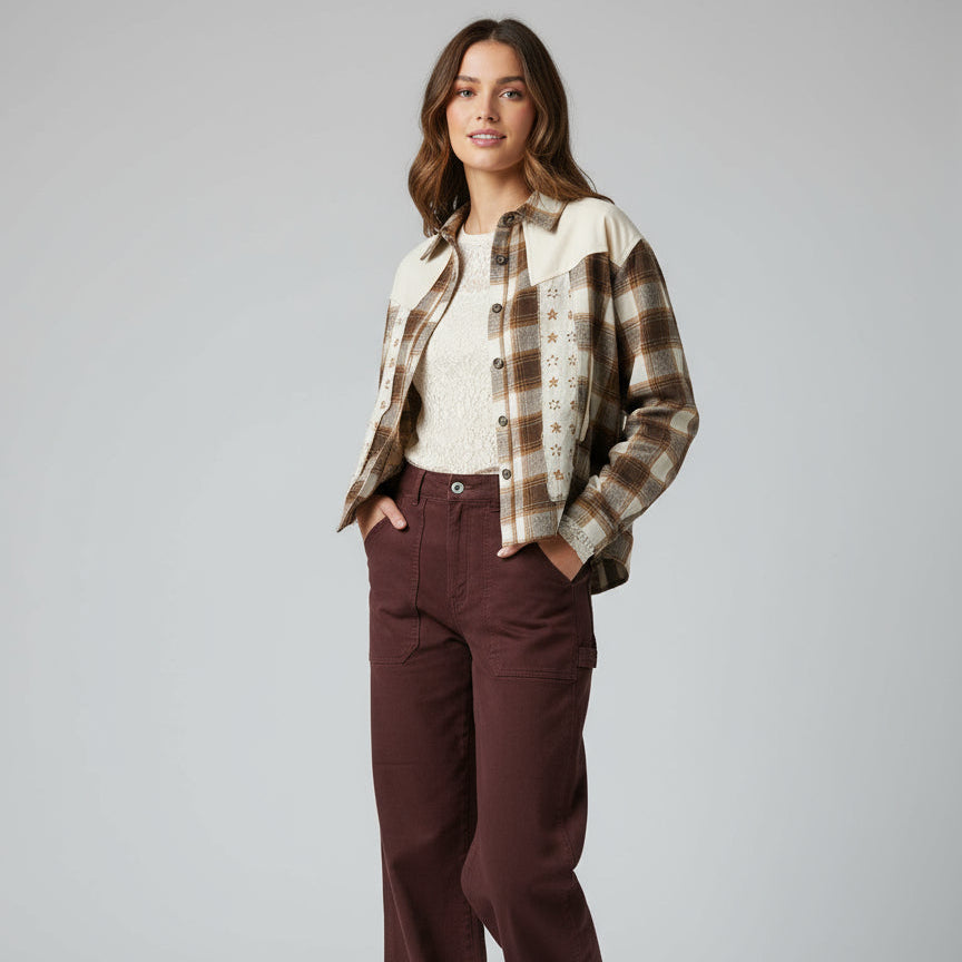 Brown pants and plaid shirt on a wooden floor