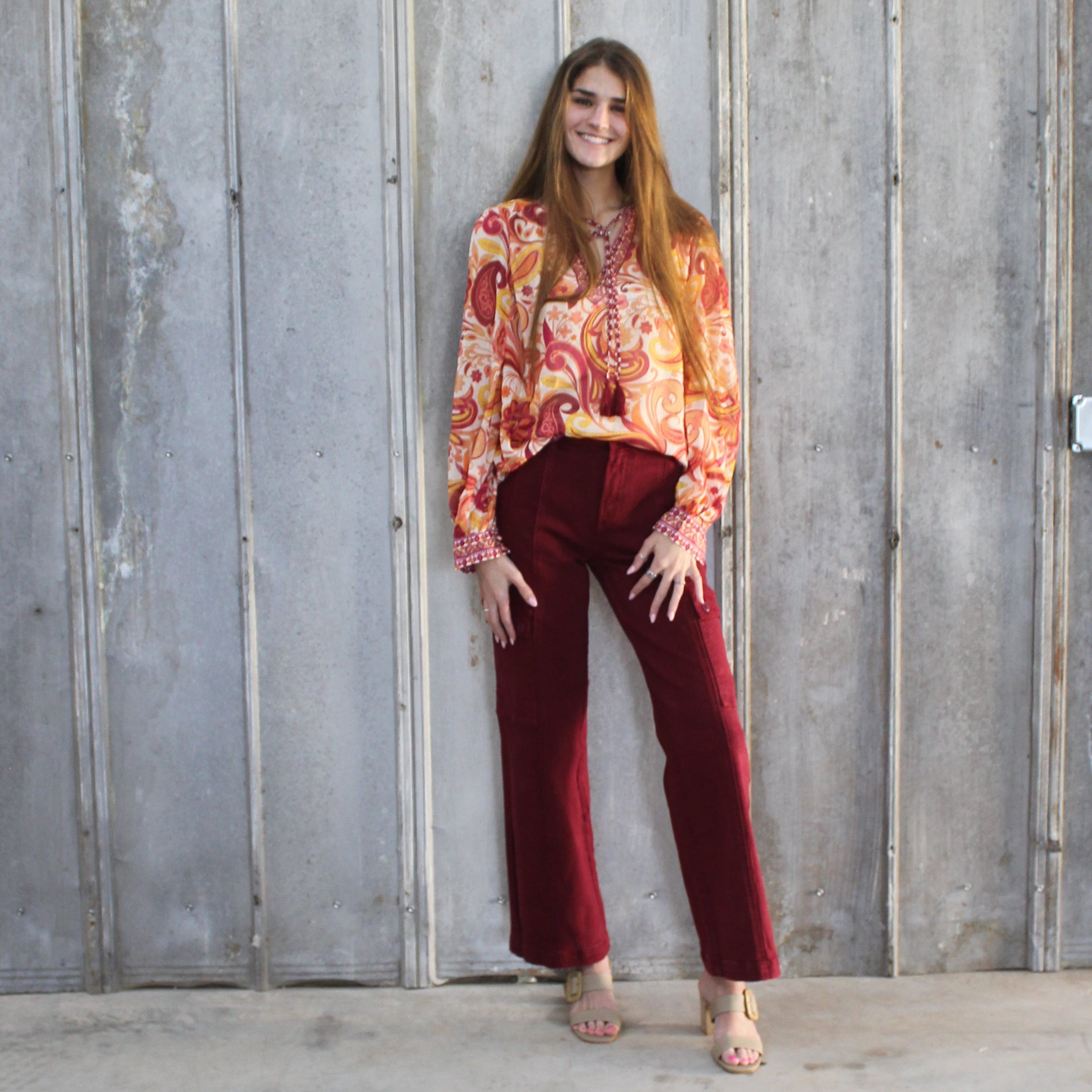 Person standing between two walls with a wooden panel on one side
