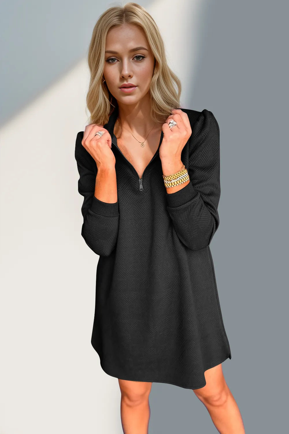 Woman wearing a black dress with a blurred background