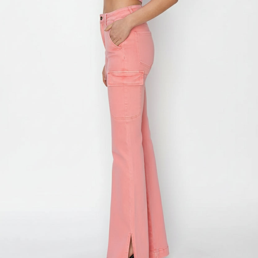 Pink flared jeans worn by a person on a white background