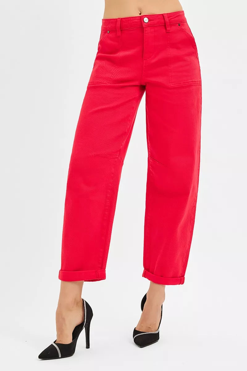 Red pants worn by a person on a white background