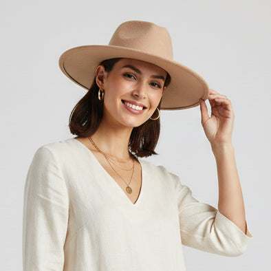 Beige fedora hat on a white background